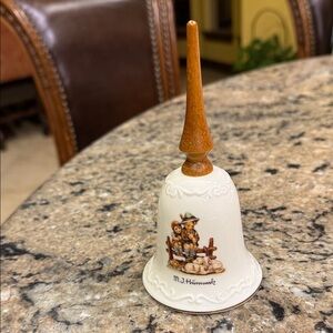 M.J. Hummel “Eventide” Bell featuring boy playing instrument to sheep